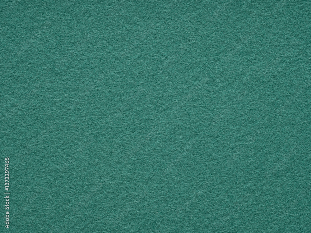 A serene expanse of textured teal felt, imbuing a sense of calm and simplicity