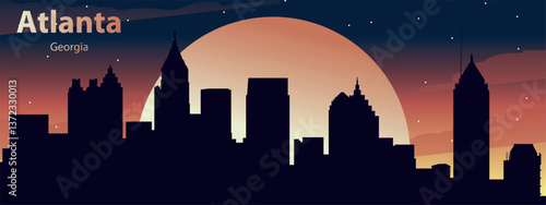 black silhouette of the city of Atlanta, Georgia against the background of the Big Yellow Moon and the night starry sky