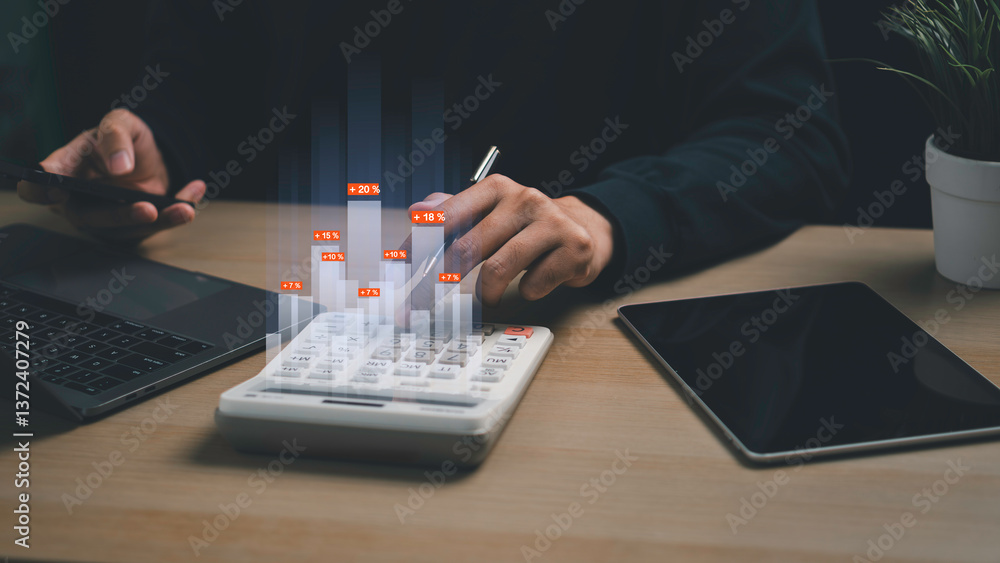 Man analyzing financial data using calculator and smartphone, with holographic bar graphs showing profit and growth metrics.
