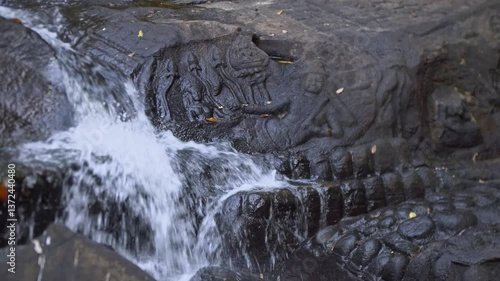 Phnom Kulen, a tranquil forest scene with a lush waterfall and soothing sounds
