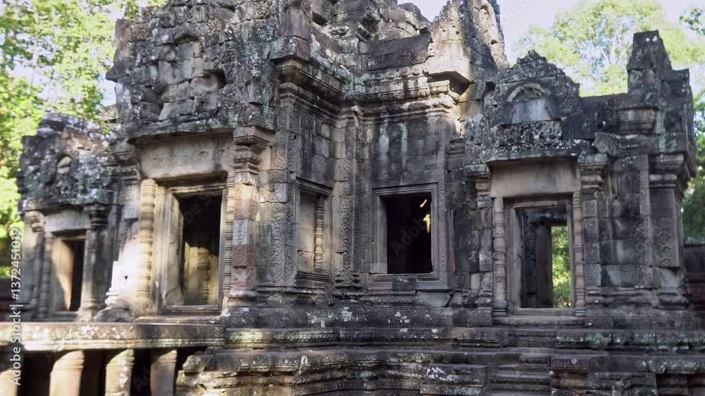 Angkor Wat, A remarkably tall building set against dense jungle backdrop Angkor Wat, A remarkably tall building set against dense jungle backdrop