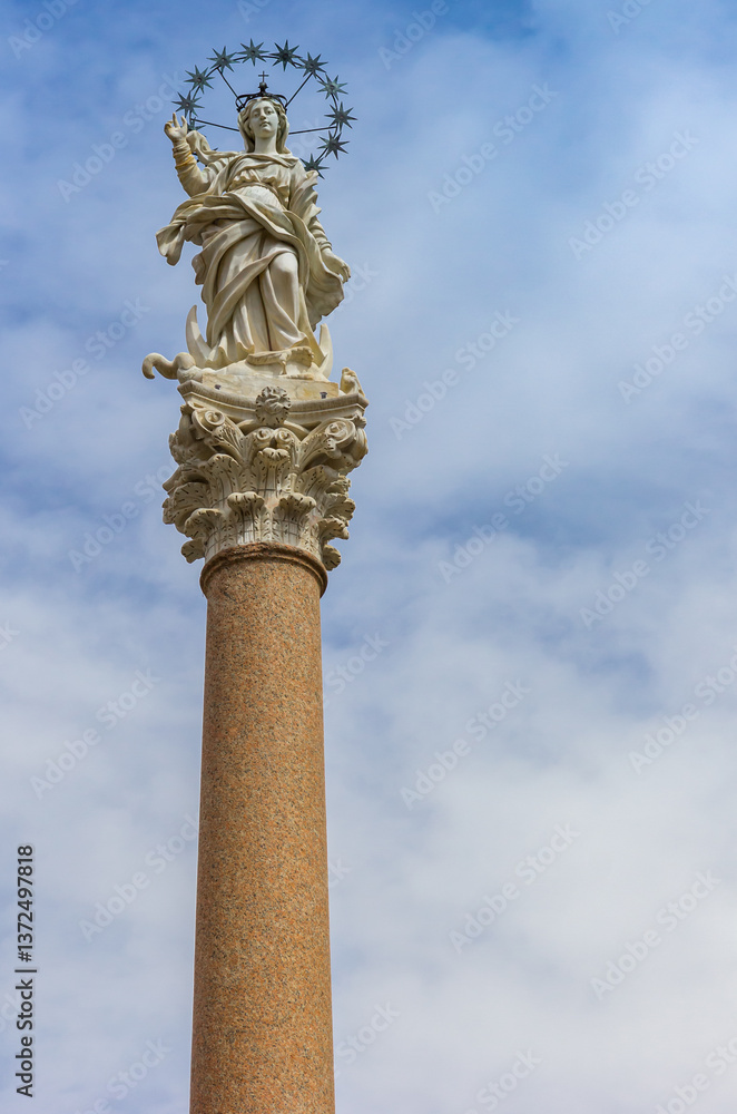 Statue of the Madonna dello Stellario on a pillar in Lucca, Italy