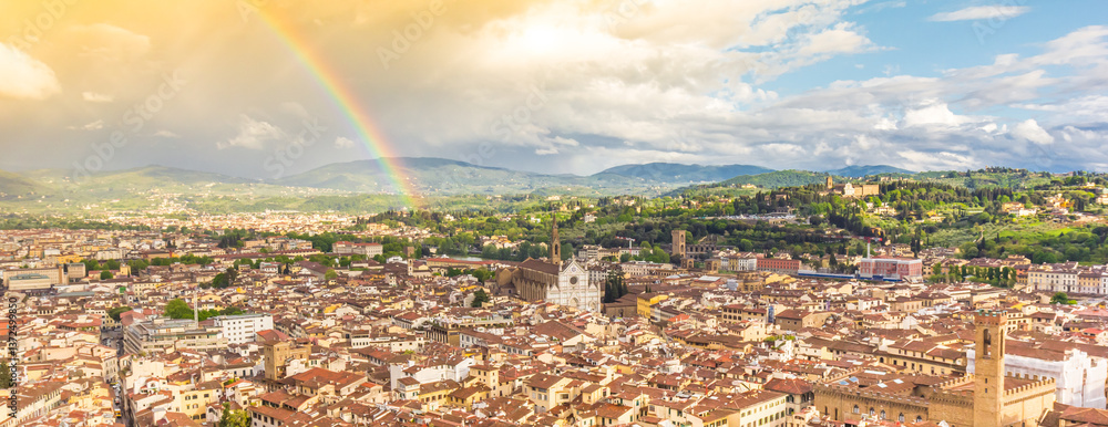 Panorama of a rainbow over the skyline of Florence, Italy