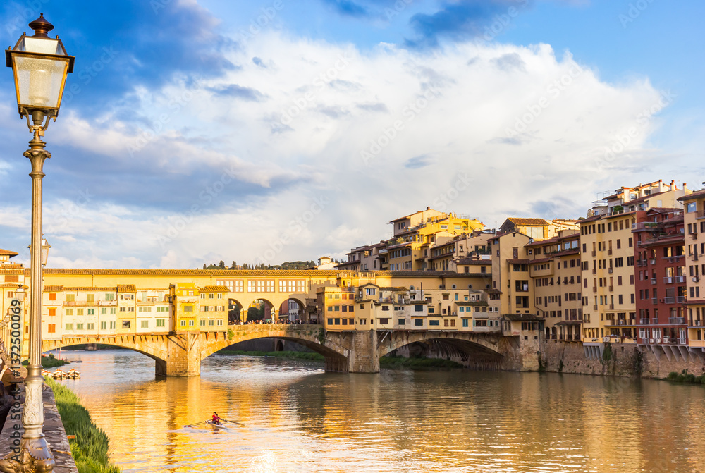 Street light at the quay near the Ponte Vecchio bridge in Florence, Italy