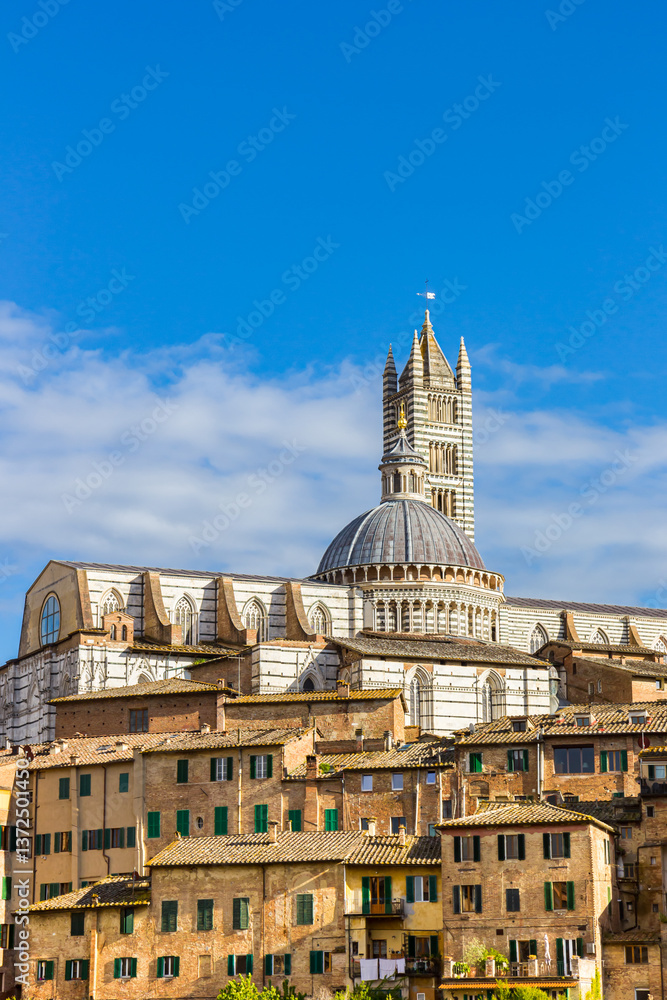 Historic Duomo cathedral on top of the hill in Siena, Italy