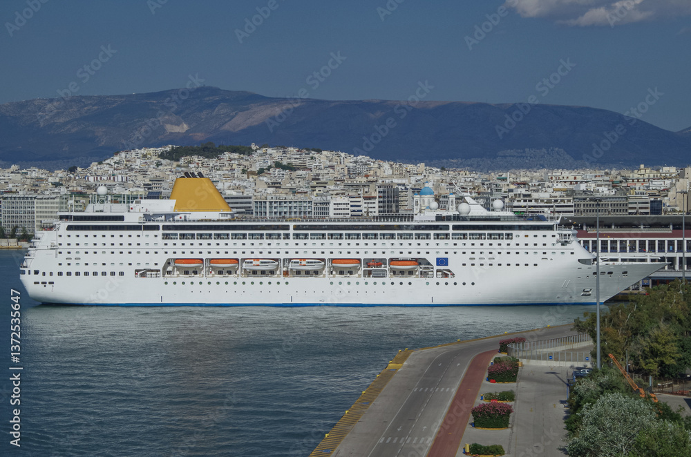 Classic cruiseship or cruise ship liner Neo Riviera in Piraeus Athens, Greece port on sunny day blue sky during Mediterranean Aegean Greek islands summer cruising dream vacation