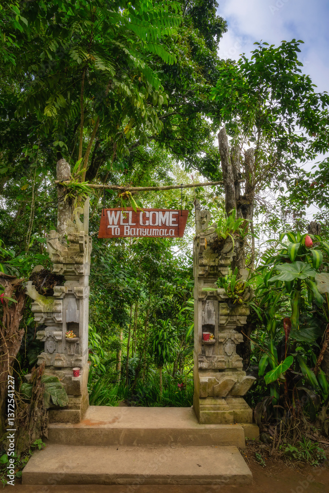 Gateway to a Tropical Paradise Step inside and welcome yourself to the Banyumala Twin Waterfalls, a vibrant and lush wilderness ahead, Bali, Indonesia