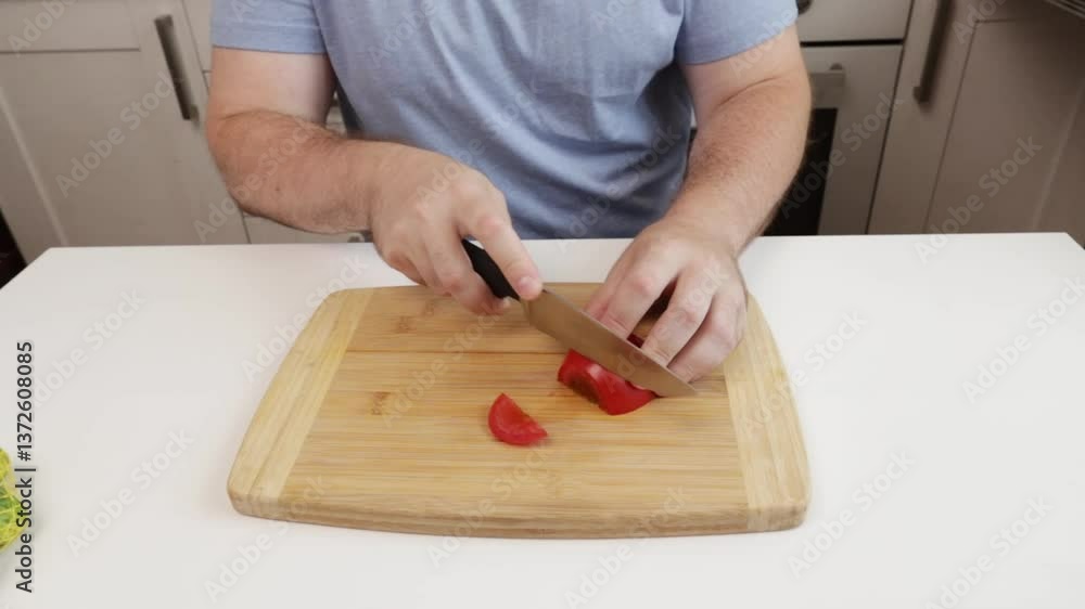 man cutting tomatoes in the kitchen, domestic home cook chopping fresh vegetables, natural recipe salad lunch man cutting tomatoes in the kitchen, domestic home cook chopping fresh vegetables, natural recipe salad lunch
