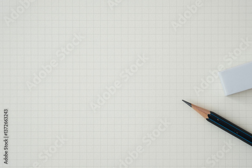 Top view, Close-up of Pencil and Eraser on Graph Paper Background, Copy Space for Text, Flat Lay Concept.