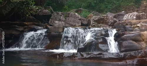 Cascading of freshwater steam, waterfall in tropical landscape and natural ecosystem in Sri Lanka