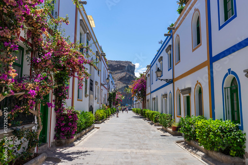 Fototapeta Naklejka Na Ścianę i Meble -  Puerto De Mogan, Gran Canaria, streets of the old village buried in flowers.
