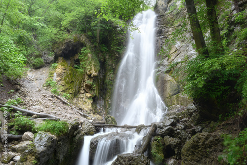 Beautiful view of Eka-chozhinsky waterfall in Ingushetia. The streams of the waterfall are blurred by the long exposure of the camera.