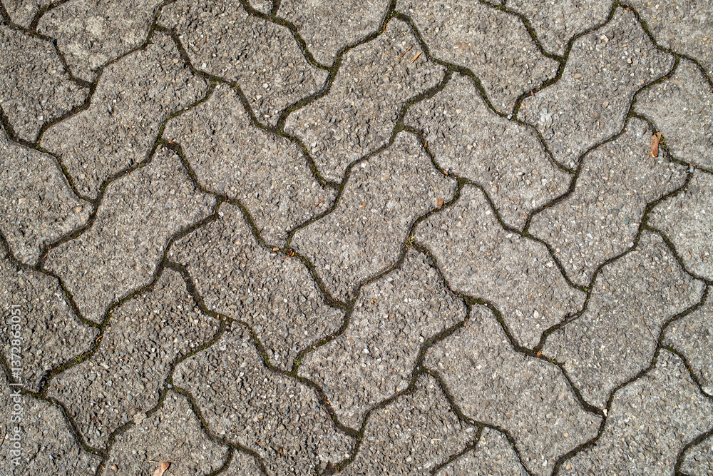 Top view of cobblestone pathway, patterned paving tiles, cement brick floor background, stone pavement Top view of cobblestone pathway, patterned paving tiles, cement brick floor background, stone pavement