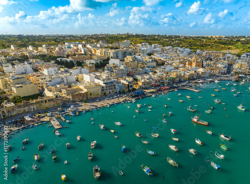 Drone top view of Marsaxlokk fish village, boats. Maltese island