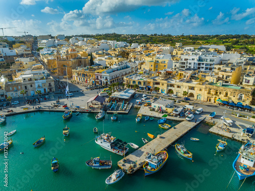 Drone aerial view of Marsaxlokk village, boats. Malta island