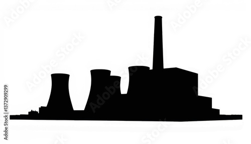 Industrial power plant silhouette at dusk with cooling towers and smokestack against a clear sky
