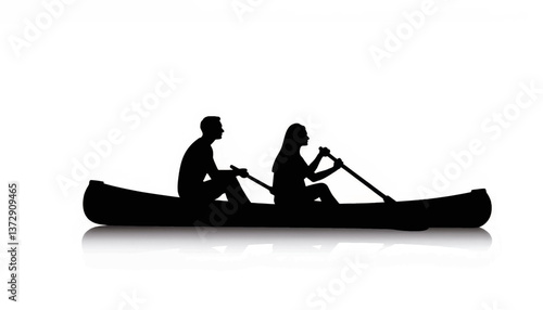 Couple paddling a canoe across a calm lake during sunset silhouette
