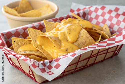 Cheesy Nachos with Fresh Tortilla Chips in Basket