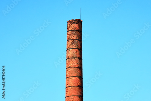 A historic building feature with clock and brick structure, suitable for backgrounds or architectural scenes.