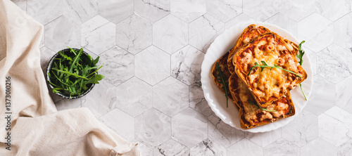 Obraz na płótnie Crispy pizza with bacon, cheese and ketchup on toast on a plate top view web banner w salonie