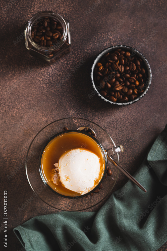 Affogato espresso coffee with vanilla ice cream in a cup on the table top and vertical view