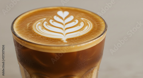 Delicious iced almond milk latte with beautiful latte art close-up shot