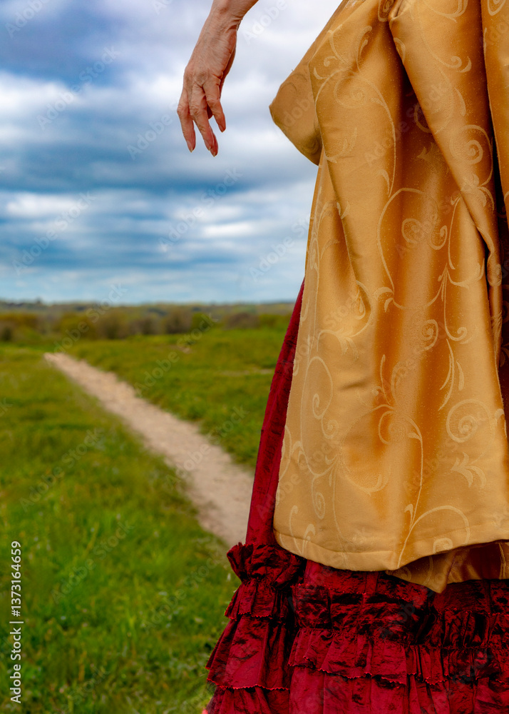 Fototapeta premium A woman wearing a dress from a past era.