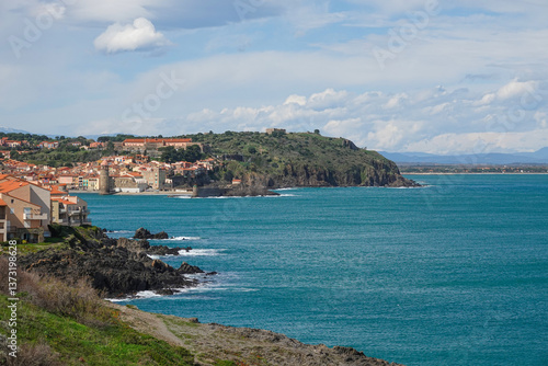 Beautiful seaside landscape featuring a Mediterranean village perched on rocky cliffs. Collioure , Occitanie, France