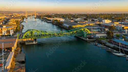 Quadro em tela Aerial view of the  Park Street Bridge, Alameda, California, USA, with boats docked in the foreground