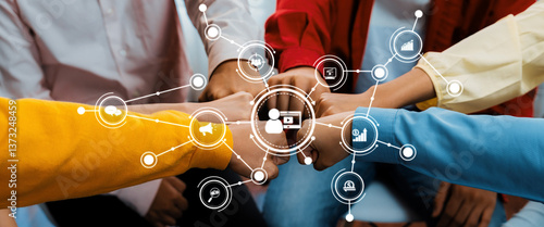 A diverse team unites in a digital marketing strategy, symbolizing collaboration and innovation. Hands come together, representing teamwork in a modern business setting focused on growth. Amity