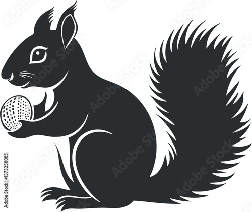 Silhouette of a squirrel holding a nut, showcasing its bushy tail and natural elegance.