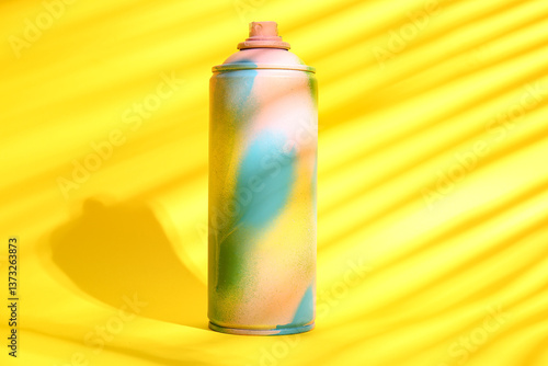 Colorful spray paint can on...