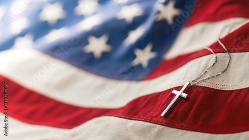 Christian cross necklace on American flag. For US Memorial Day, Veterans Day, USA memorial or military funeral. Representing honor and sacrifice of the armed forces from the United States of America.