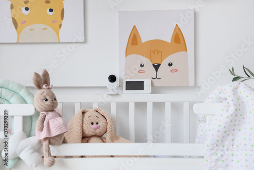 Baby monitor on crib in nur...