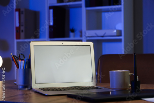 Wallpaper Mural Blank laptop with stationery and cup on desk in office at night Torontodigital.ca