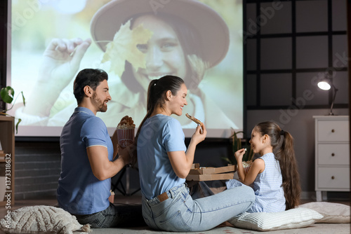 Family eating while watchin...