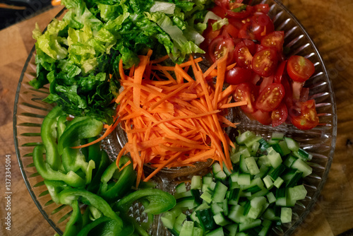 Wallpaper Mural Top down view of freshly sliced and chopped salad ingredients arranged on a glass plate Torontodigital.ca