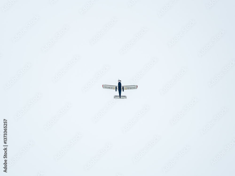 Small ultralight airplane with overhead wing and single propeller flying in sunset sky. Small ultralight airplane with overhead wing and single propeller flying in sunset sky.