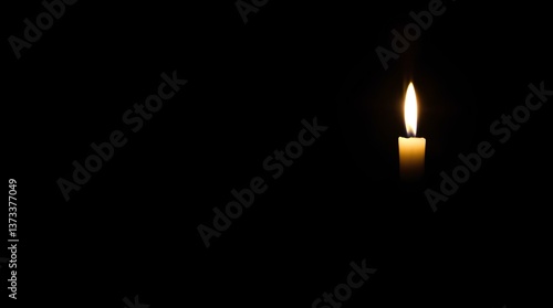 A single candle burning in the darkness, representing solitude, hope, and the power of light. The gentle flicker of the flame evokes warmth and contemplation in a mysterious atmosphere.

