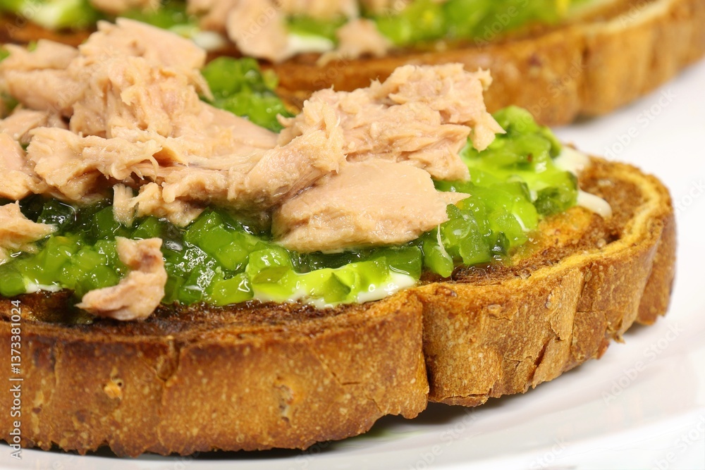 crispy toast with tuna and pickles, close up crispy toast with tuna and pickles, close up