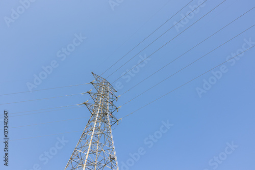 Obraz na płótnie Electricity transmission powerline against blue sky view w salonie