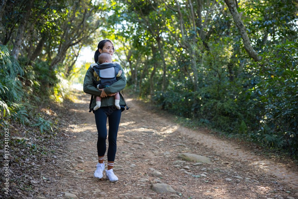 Woman exploring nature with her baby