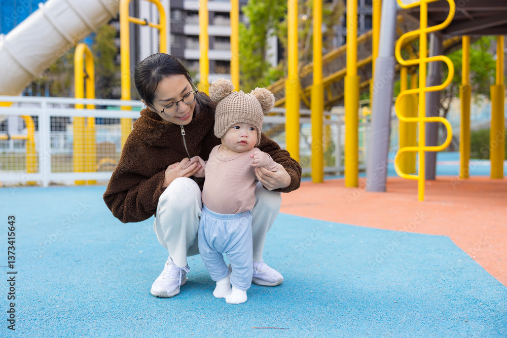 Little child walking with mother outdoor city