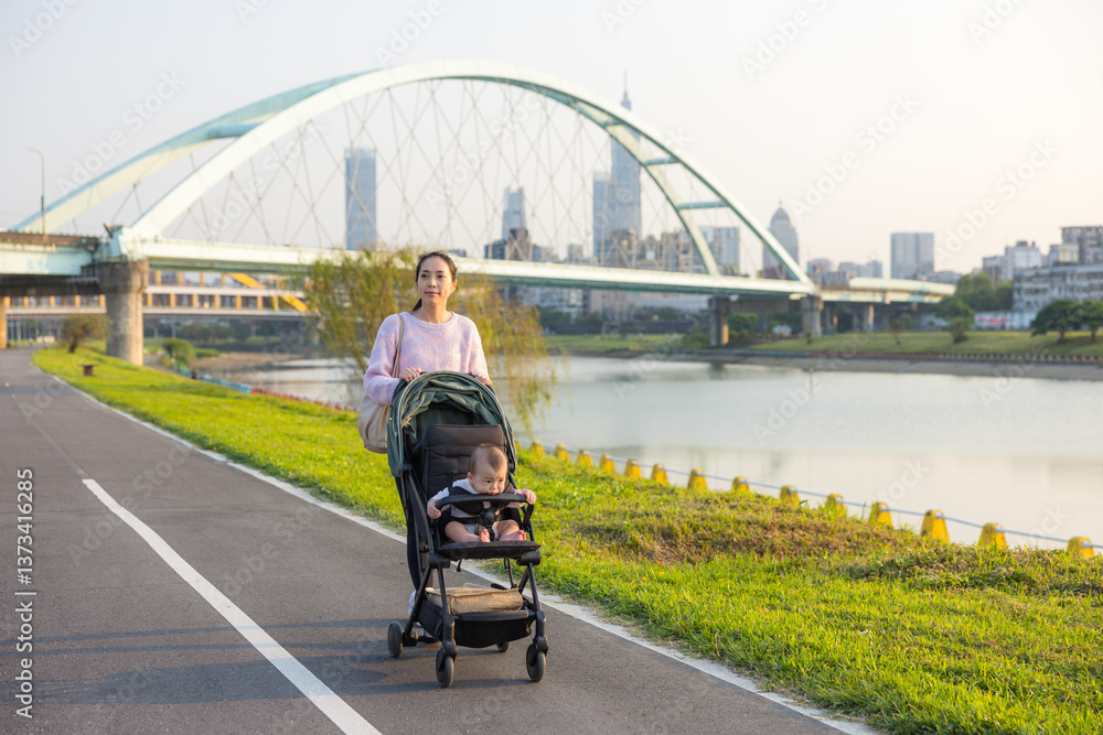 Mom Pushing Baby Stroller Near Water