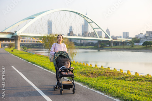 Obraz na płótnie Mom Pushing Baby Stroller Near Water w salonie