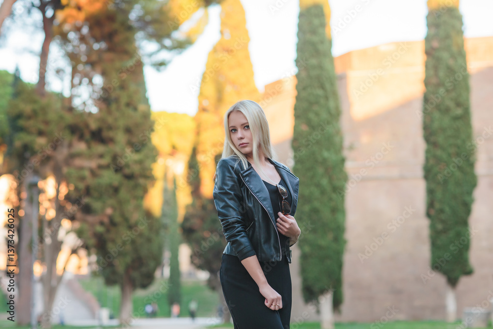 A Stylish Woman Taking Time to Relax in a Beautiful Historic Roman Landscape Setting
