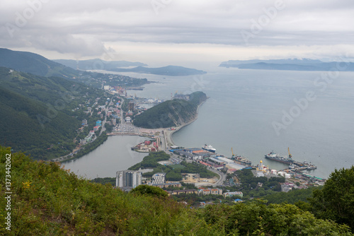 Obraz na płótnie View from Mishennaya Sopka to the port city of Petropavlovsk-Kamchatsky, located on the coast of the Avacha Bay of the Pacific Ocean. Kamchatka, Far East of Russia. Top view of buildings and streets. w salonie