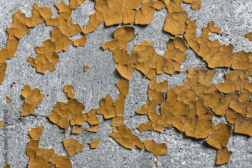 Obraz na płótnie Peeling paint on the wall. Old concrete wall with cracked flaking paint. Weathered rough painted surface with patterns of cracks and peeling. High resolution texture for background and design. Closeup w salonie