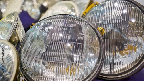 Collection of Vintage Car Headlights Displayed at an Automotive Swap Meet in the Early Afternoon in Italy