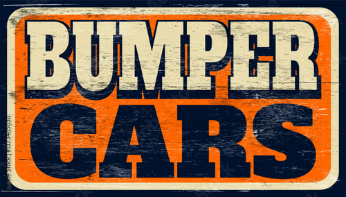 Aged and worn bumper cars sign on wood